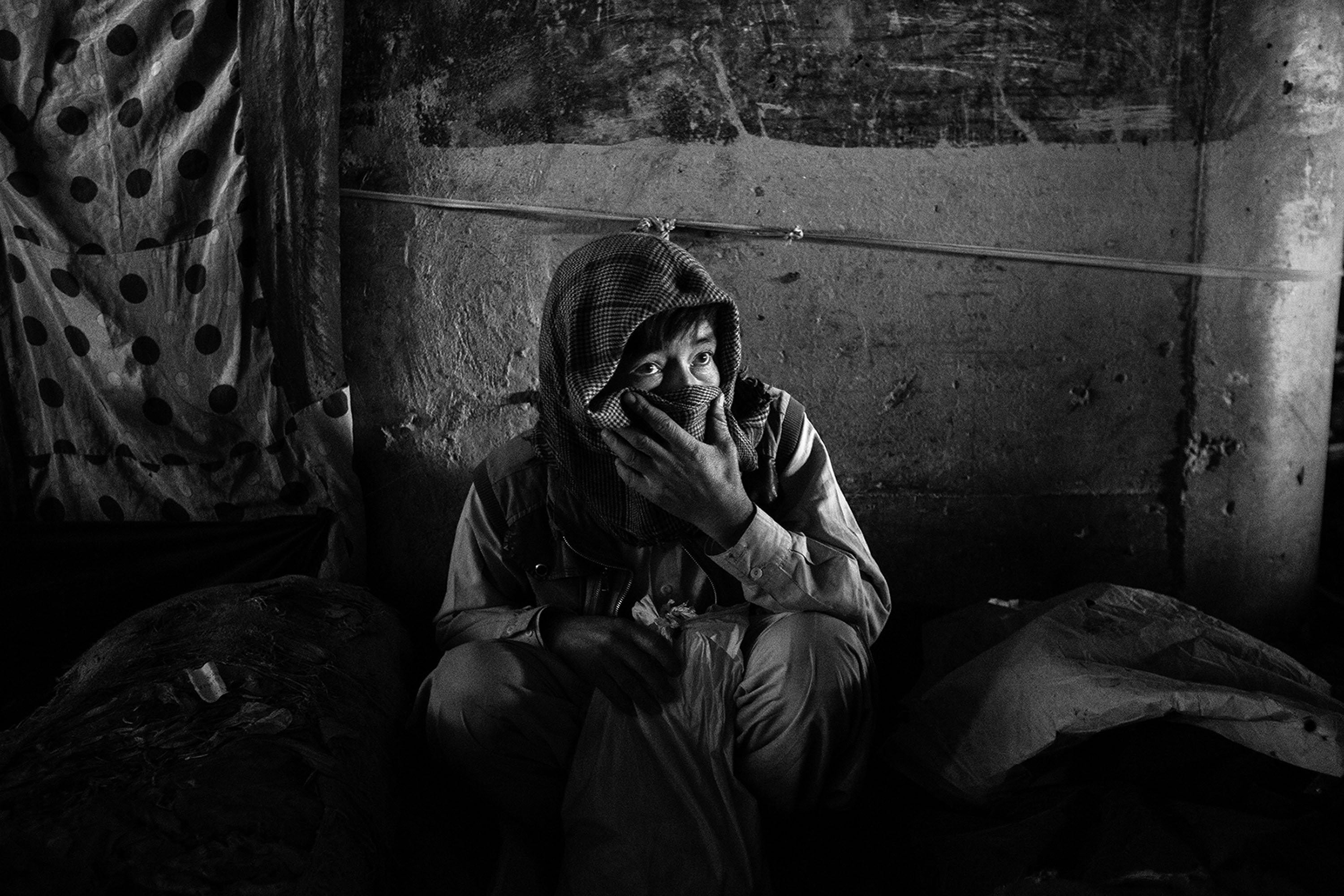 26/10/2017 - Afghanistan, Kabul. A drug addict under the Poly Sokhta Bridge.