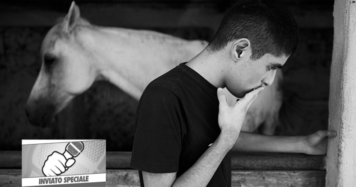 Italy, Succivo (CE), 17/07/2015. Gennaro, one of the two autistic twins, in a riding school during a closing moment. The horse represents a very important animal for the boys and their family. The twins in fact do not speak and the only time that Maurizio, one of the two spoke, said the word 